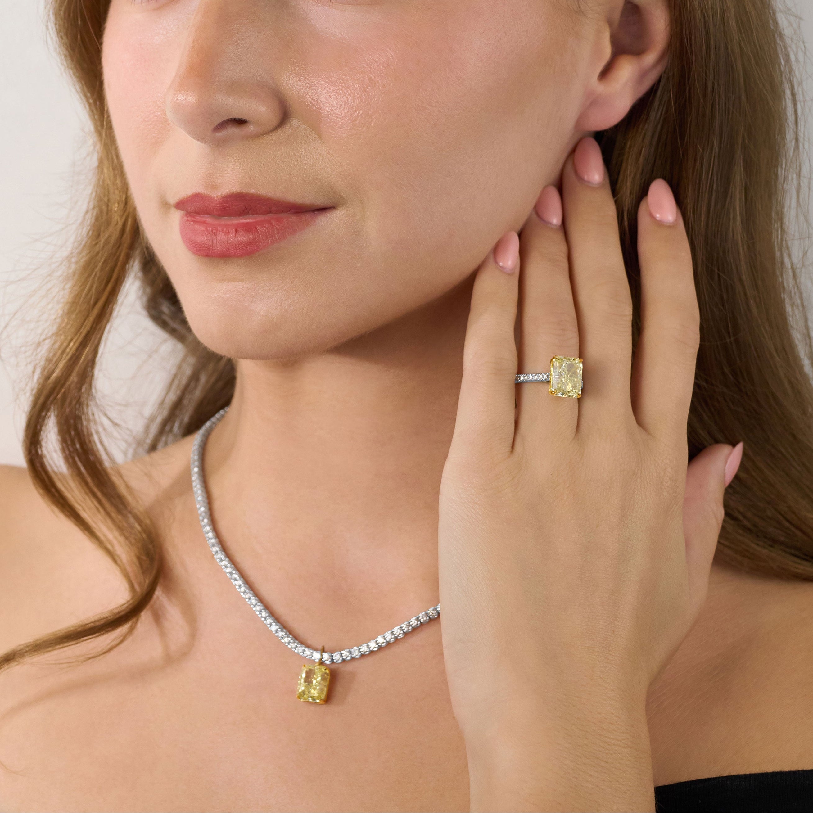 5.51ct Radiant Cut Yellow Diamond Ring With Diamond Set Shoulders and Bezels