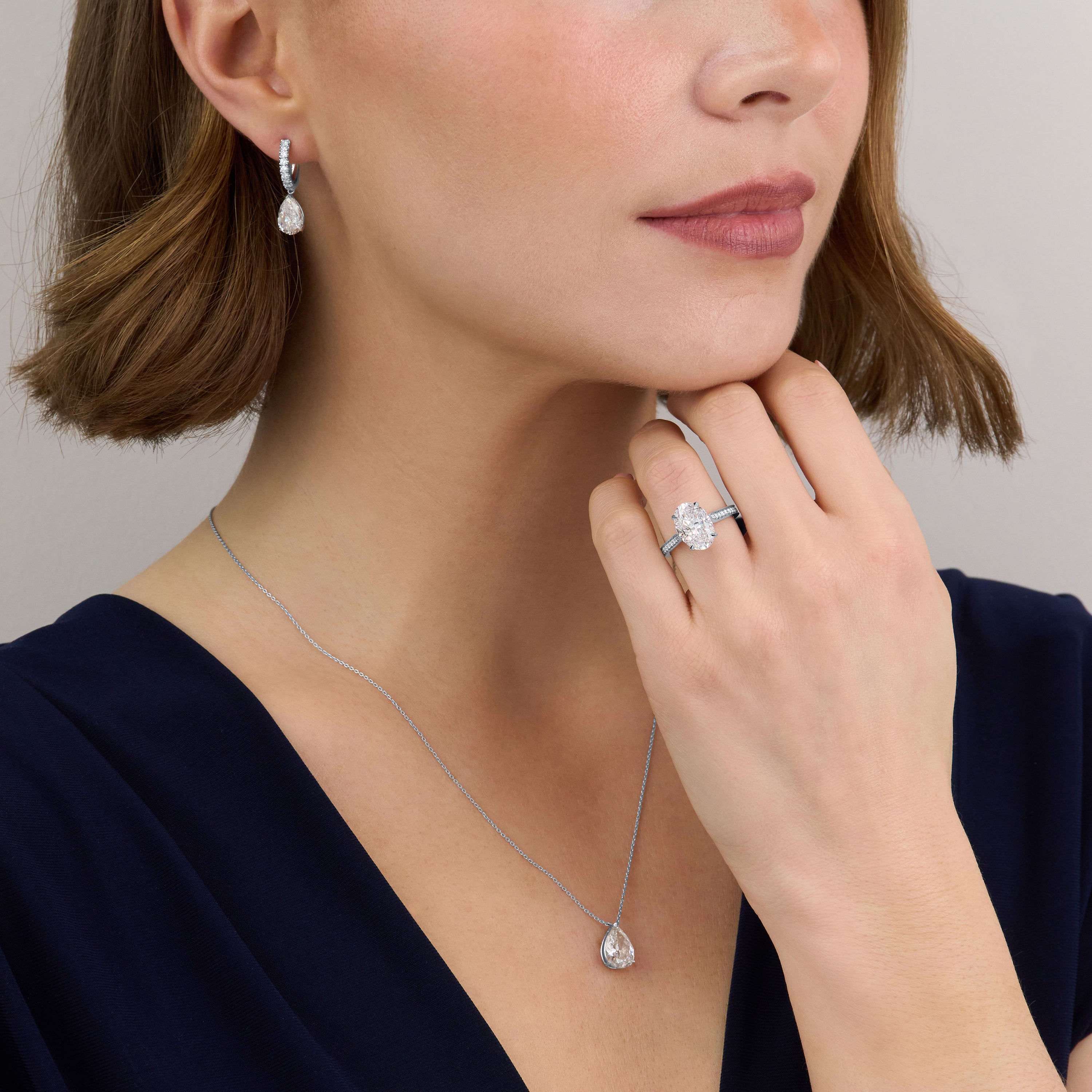 3.56ct Oval Cut Diamond Ring With Diamond Set Shoulders and Bezels