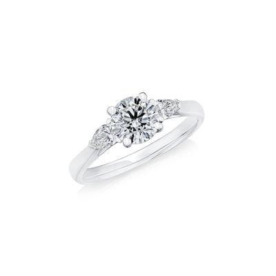 0.90ct Round Brilliant and Pear Cut Diamond Three Stone Ring