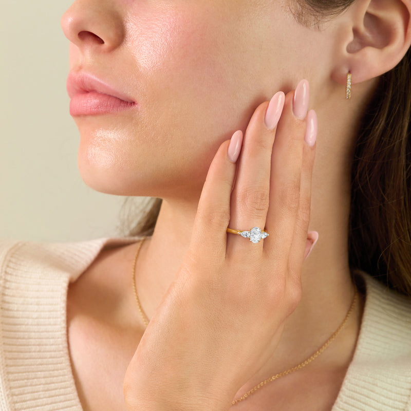Oval and Pear Cut Diamond Three Stone Ring