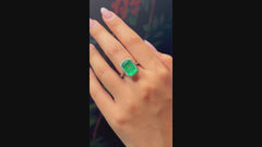 Emerald rubover diamond surround ring